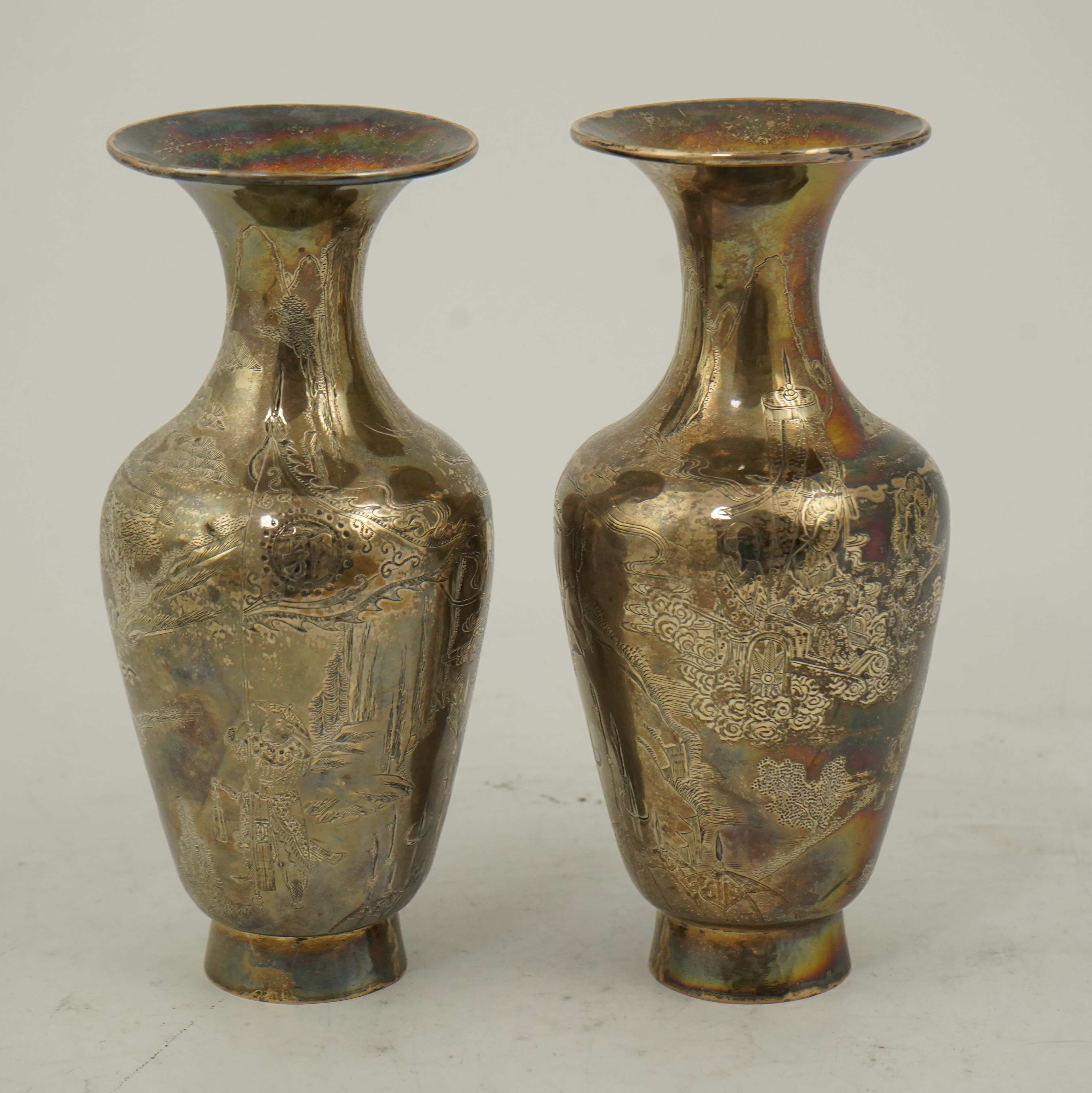 A pair of Chinese silver ‘immortals’ vases, late 19th century